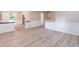 Open-concept living room offers new floors and decorative wainscoting at 4171 Whispering Forest Sw Ct, Lilburn, GA 30047