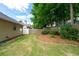 View of the back yard including grass and wood privacy fence at 4584 Brook Farms Dr, Duluth, GA 30096