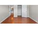 Bedroom featuring wood floors, access to bathroom and walk-in closet at 4584 Brook Farms Dr, Duluth, GA 30096