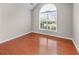 Bedroom with high ceilings, large window, and wood floors at 4584 Brook Farms Dr, Duluth, GA 30096