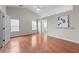 Spacious main bedroom with hardwood floors, ensuite bathroom, and vaulted ceiling at 4584 Brook Farms Dr, Duluth, GA 30096
