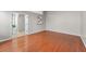 Spacious bedroom featuring pristine hardwood floors and an en-suite bathroom at 4584 Brook Farms Dr, Duluth, GA 30096