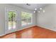 Charming breakfast nook features hardwood floors, natural light, and door to the outside at 4584 Brook Farms Dr, Duluth, GA 30096