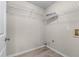 Walk-in closet with installed shelving and wood-look floors at 4584 Brook Farms Dr, Duluth, GA 30096