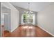Bright dining room features hardwood floors, neutral paint, and modern light fixture at 4584 Brook Farms Dr, Duluth, GA 30096