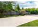 Long driveway leads to the home with a landscaped yard and wooden fence at 4584 Brook Farms Dr, Duluth, GA 30096