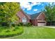 Charming brick home with manicured lawn and mature trees creating an inviting curb appeal at 4584 Brook Farms Dr, Duluth, GA 30096