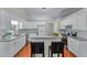 Spacious kitchen with white cabinets, an island, granite countertops, and stainless-steel appliances at 4584 Brook Farms Dr, Duluth, GA 30096