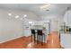Charming eat-in kitchen with modern light fixture, an island, and updated appliances at 4584 Brook Farms Dr, Duluth, GA 30096