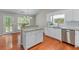 Well-lit kitchen features an island, granite countertops, stainless steel appliances, and a window at 4584 Brook Farms Dr, Duluth, GA 30096