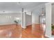 Open-concept living room with hardwood floors, white trim, and plenty of natural light at 4584 Brook Farms Dr, Duluth, GA 30096