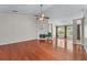 Spacious living room featuring hardwood floors, fireplace, and abundant natural light at 4584 Brook Farms Dr, Duluth, GA 30096