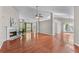 Spacious living room features hardwood floors, fireplace, ceiling fan, and abundant natural light at 4584 Brook Farms Dr, Duluth, GA 30096