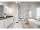Bright, spacious bathroom with double vanity, soaking tub, and walk-in shower at 5370 Newport Bay Psge, Alpharetta, GA 30005