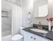 Modern bathroom with a shower over the bath, a stylish vanity, and attractive decorative touches at 5370 Newport Bay Psge, Alpharetta, GA 30005
