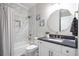 Stylish bathroom with marble tile, granite countertops, and brushed gold fixtures at 5370 Newport Bay Psge, Alpharetta, GA 30005