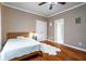 Comfortable bedroom features a cozy bed, warm lighting, and ample closet space for storage at 5370 Newport Bay Psge, Alpharetta, GA 30005