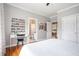 Relaxing bedroom area featuring natural light, a desk, and access to a bathroom and closet at 5370 Newport Bay Psge, Alpharetta, GA 30005