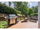 Spacious deck with outdoor seating and grill, perfect for entertaining and relaxation at 5370 Newport Bay Psge, Alpharetta, GA 30005