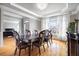 Elegant dining room with hardwood floors, tray ceilings, and modern chandelier at 5370 Newport Bay Psge, Alpharetta, GA 30005
