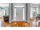 Welcoming foyer with hardwood floors, elegant columns and abundant natural light at 5370 Newport Bay Psge, Alpharetta, GA 30005