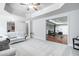 Spacious and bright living room with plush carpeting, a modern tray ceiling, and an open layout at 5370 Newport Bay Psge, Alpharetta, GA 30005