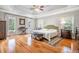 This main bedroom offers an elegant tray ceiling, with two large windows to provide natural light at 5370 Newport Bay Psge, Alpharetta, GA 30005