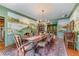 Formal dining room with mural, chandelier lighting, and ample seating for Gathering gatherings at 5945 W Andechs Smt, Johns Creek, GA 30097