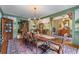 Formal dining room with mural, chandelier lighting, and ample seating for Gathering gatherings at 5945 W Andechs Smt, Johns Creek, GA 30097