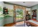 Dining room featuring mural walls, natural light, and views to the outside yard at 5945 W Andechs Smt, Johns Creek, GA 30097