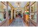 Welcoming foyer featuring hardwood floors, elegant wallpaper, and views of the home's living spaces at 5945 W Andechs Smt, Johns Creek, GA 30097