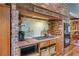 Quaint kitchen features exposed brick, custom shelves and storage, plus stainless appliances at 5945 W Andechs Smt, Johns Creek, GA 30097