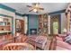Inviting living room featuring a cozy fireplace, plush seating and built in bookcases at 5945 W Andechs Smt, Johns Creek, GA 30097