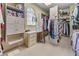 Spacious walk-in closet with custom shelving and sewing machine at 5945 W Andechs Smt, Johns Creek, GA 30097