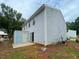 Backyard view of a two-story house with siding, a shed, and a concrete patio at 6366 Jasper Ct, Tucker, GA 30084