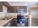 Well-equipped kitchen with stainless steel oven and microwave, ample cabinet space, and updated finishes at 6366 Jasper Ct, Tucker, GA 30084