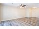 Spacious living room featuring modern flooring, neutral walls, and a ceiling fan for efficient climate control at 6366 Jasper Ct, Tucker, GA 30084