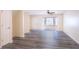 Bright living room with updated flooring, a bay window, and a ceiling fan for added comfort at 6366 Jasper Ct, Tucker, GA 30084