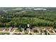 Aerial shot of the property, illustrating its position within a peaceful community surrounded by mature trees and greenery at 1583 Rogers Crossing Dr, Lithonia, GA 30058