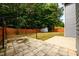 Backyard featuring a paver patio, gazebo, storage shed, and a wood fence for privacy at 1583 Rogers Crossing Dr, Lithonia, GA 30058