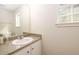 Bathroom featuring vanity sink with stone countertops and white cabinets at 1583 Rogers Crossing Dr, Lithonia, GA 30058