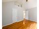 Spacious bedroom with hardwood floors and large closet doors at 1583 Rogers Crossing Dr, Lithonia, GA 30058