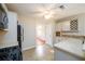 Bright kitchen featuring stainless appliances, tile backsplash and updated light colored cabinets at 1583 Rogers Crossing Dr, Lithonia, GA 30058