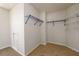 Walk-in closet featuring carpeted floor and wire shelving for clothing and storage at 1583 Rogers Crossing Dr, Lithonia, GA 30058
