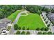Large grassy field with a paved loop and adjacent homes in a residential area at 1839 Kent Ave, Atlanta, GA 30338