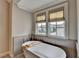 Sunlit bathroom showcasing a soaking tub beneath two windows at 1839 Kent Ave, Atlanta, GA 30338
