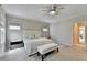 Bedroom with neutral colors, carpet, bench seating and doorway into bathroom at 1839 Kent Ave, Atlanta, GA 30338