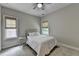 Neutral bedroom with carpet, ceiling fan, and windows providing natural light at 1839 Kent Ave, Atlanta, GA 30338