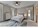 A calm and inviting bedroom with neutral décor and a large area rug at 1839 Kent Ave, Atlanta, GA 30338