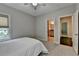 Neutral bedroom with carpet and view into the bathroom at 1839 Kent Ave, Atlanta, GA 30338